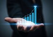 © kale.studio - Businessman's Hand Holding A Glowing Holographic Bar Chart Showing Financial Growth And Success With A Projection For 2024, Business Growth, Investment Forecast