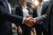 © Iftikhar alam - Business colleagues engage in a successful handshake during a collaborative meeting in a modern office setting in the afternoon