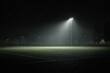© Idea - A lone floodlight illuminates a misty, empty sports field at night