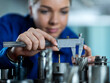 © BusinessClass by W61 - Trainee measuring CNC tool with caliper in factory