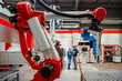 © BusinessClass by W61 - Colleagues working together in robot factory