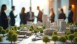 © Maryna - Urban architecture model at real estate event. Professionals discuss development, investment, construction design. City landscape display includes landscaping, community planning, collaboration,