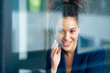 © BusinessClass by W61 - Smiling businesswoman listening through headset in soundproof cabin
