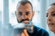 © BusinessClass by W61 - Thoughtful businessman with colleague looking at drone in home office