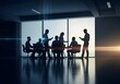 © senyumanmu - Business meeting in a modern conference room with people silhouetted