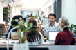 © BusinessClass by W61 - Businessman discussing with colleagues at desk