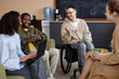 © BusinessClass by W61 - Smiling business people siting with coffee cups and having discussion in office