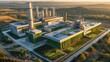 © Palmesrk - Aerial view of a modern energy facility surrounded by greenery, showcasing industrial innovation and sustainability at sunset