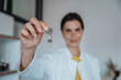 © BusinessClass by W61 - USB stick being held by female doctor in clinic