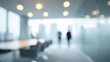 © Arif - Blurred office corridor with bokeh ceiling lights and walking silhouettes. Minimal modern interior framing. Focus on uncertainty and forward momentum. Ideal for leadership, strategy