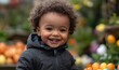 © Shikha Arts - Happy toddler with Easter eggs in a garden, partaking in an Easter egg hunt, representing childhood delight and the excitement of holiday traditions in an inclusive and joyful setting, Generative AI