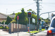 © Austockphoto - red stop light and no stopping sign at roadside