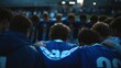 © IMOTIONart - Sports Team Huddling Together In Blue And White Uniforms Displaying Unity And Teamwork