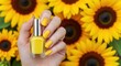 © Moslema - Vibrant Yellow Nail Polish with Sunflower Background
