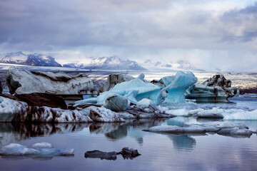 Wall Mural - beautiful blue icebergs reflected in the jokulsarlon glacial lagoon, southern iceland. part of the v