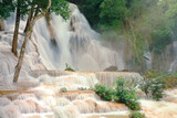 Close up of Kuang Si Waterfalls in Luang Prabang Laos. Long exposure. Beautiful waterfall in wild jungle