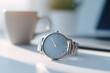 © Сергей Захаров - sleek wristwatch on uncluttered desk with minimalist aesthetic and ample copy space