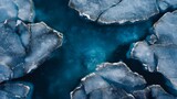 Icebergs and blue water, a breathtaking aerial view, capturing the raw beauty of the arctic landscape. The icebergs form a unique pattern with the cold turquoise water, presenting an alluring nature