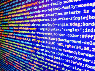 screen at wor. simple website html code with colourful tags in browser view on dark background