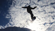 © TUL - Snowboarder performing an impressive aerial trick against a stunning backdrop of snowy mountains