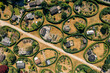 © Amazing Aerial - Aerial view of the round gardens, a whimsical landscape of neatly manicured circular plots, each a tiny world of verdant hedges and miniature dwellings, NÃ¦rum, Denmark.