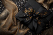 © xadartstudio - Black gift box with gold ribbon and glitter elegant present luxury holiday