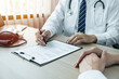 © Ngampol - Doctor consulting with the patient and checking sickness condition while presenting results diagnosis symptom examining about the problem of illness and recommend treatment method