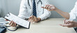 © Ngampol - Doctor consulting with the patient and checking sickness condition while presenting results diagnosis symptom examining about the problem of illness and recommend treatment method