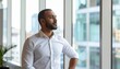 © True Stock - Middle Eastern businessman taking a mindful break by the office window in a moment of reflection