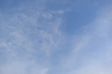 Wall Mural - beautiful blue sky and white cloud background in springtime