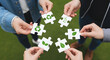 © isma01 - People Join Eco Puzzle Pieces Together on Green Background for Environment & Collaboration