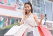 © dodotone - Walking asian woman travel and shopping in city lifestyles at outdoors on day