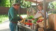 © VAKSMANV - Handsome Caucasian man buying natural vegetables and fresh fruits at farmers market counter. Spending money. Pretty female seller placing natural products in paper bag. Concept of business industry.