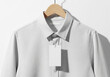 © Paylopi - Blank White Hang Tag Mockup on Light Grey Shirt with Wooden Hanger - Apparel Branding, Price Tag Design & Retail Product Display