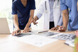 © SOMKID - Medical team brainstorming having a meeting in conference room at hospital, Medical technology and health care concept.