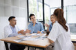 © SOMKID - Medical team having a meeting in conference room at hospital, Medical technology and health care concept.