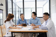 © SOMKID - Medical team having a meeting in conference room at hospital, Medical technology and health care concept.
