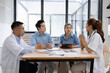 © SOMKID - Medical team having a meeting in conference room at hospital, Medical technology and health care concept.