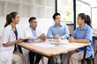 © SOMKID - Medical team having a meeting in conference room at hospital, Medical technology and health care concept.