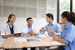 © SOMKID - Medical team having a meeting in conference room at hospital, Medical technology and health care concept.