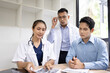 © SOMKID - Medical team having a meeting in conference room at hospital, Medical technology and health care concept.