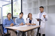 © SOMKID - Medical team having a meeting in conference room at hospital, Medical technology and health care concept.