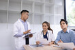 © SOMKID - Medical team having a meeting in conference room at hospital, Medical technology and health care concept.