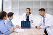 © SOMKID - Medical team with laptop computer and examine x ray test results for treatment plans in a modern hospital, Healthcare and medical concept.