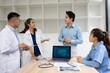 © SOMKID - Medical team with laptop computer and examine x ray test results for treatment plans in a modern hospital, Healthcare and medical concept.