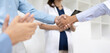 © SOMKID - Doctors shaking hands in meeting room at hospital , Healthcare and medical concept.