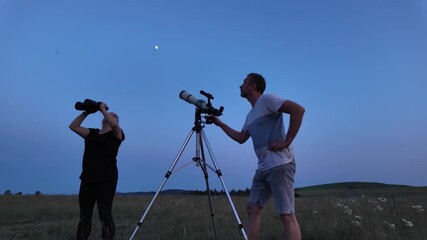 Wall Mural - amateur astronomers using telescope and binoculars for watching stars, moon, planets and other celes