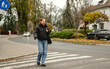 © tan4ikk - Girl Crossing The Road At A Pedestrian Crossing