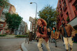 © bernardbodo - Group of young tourists running in Barcelona city center