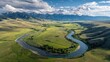 © Pixel - High-angle view of a meandering river winding through a valley, surrounded by grassy plains and mountains